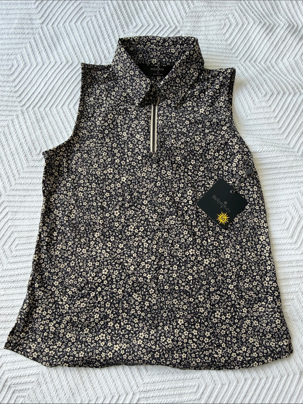 Belyn Key Black and Cream Sleeveless Floral Zip Polo Tank